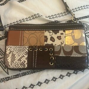Coach signature patchwork wristlet- EUC A05U-40913